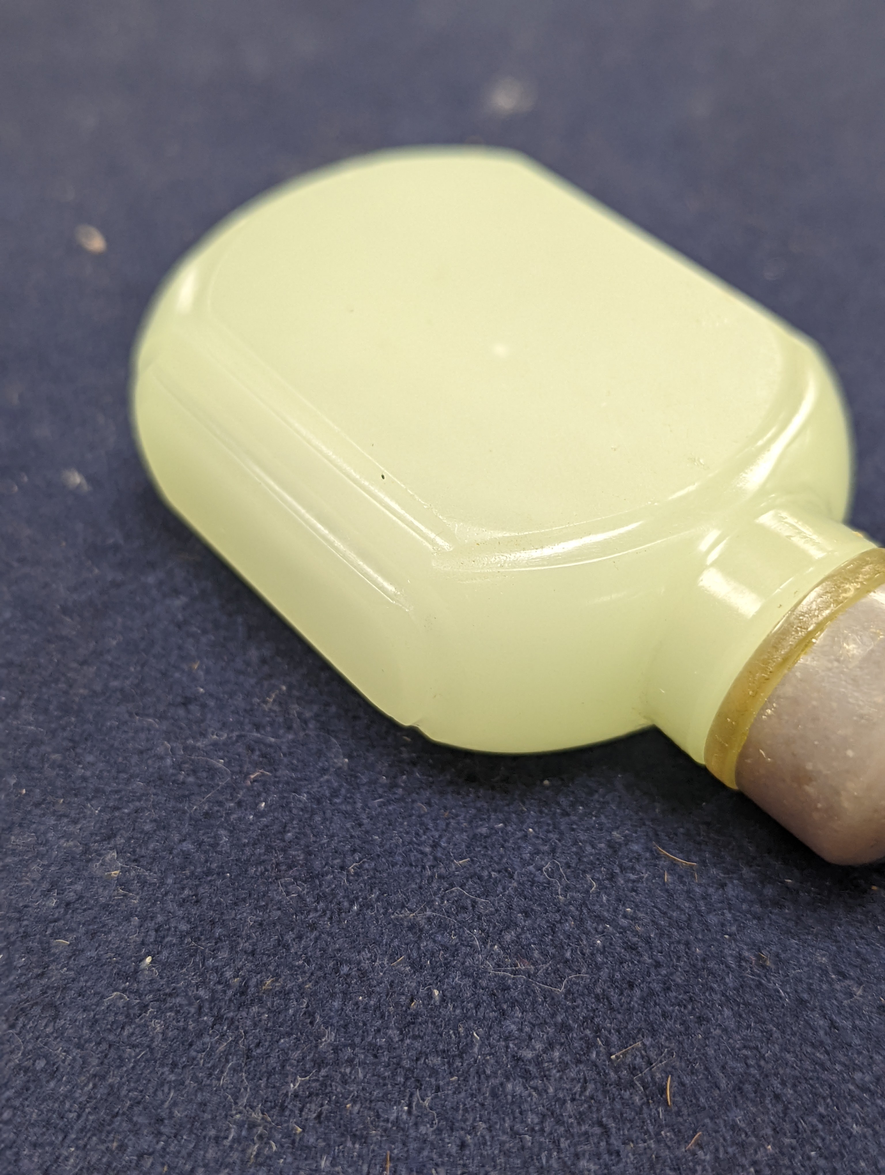 A Chinese jade belt hook, 12.5cm an archer's ring and figure, a stone cup and a glass snuff bottle